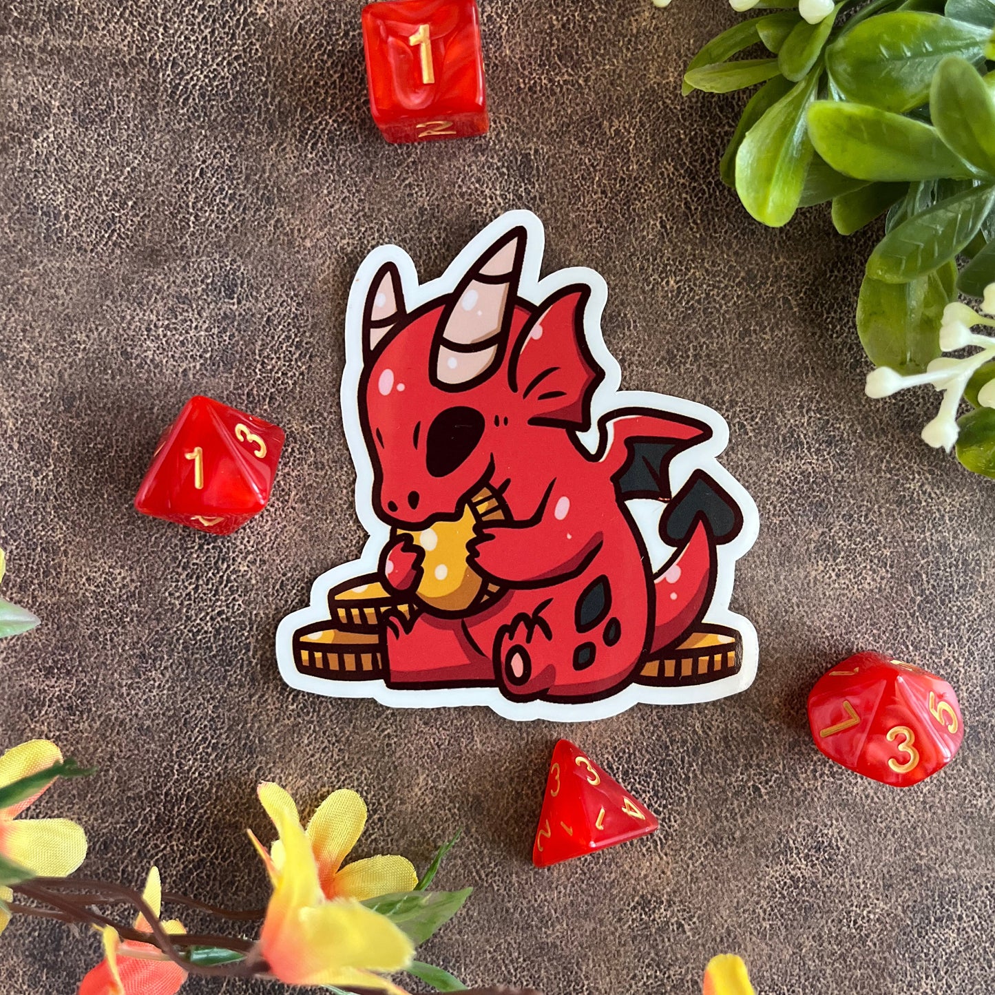 The sticker is accented with dice and flowers with an alternate background.